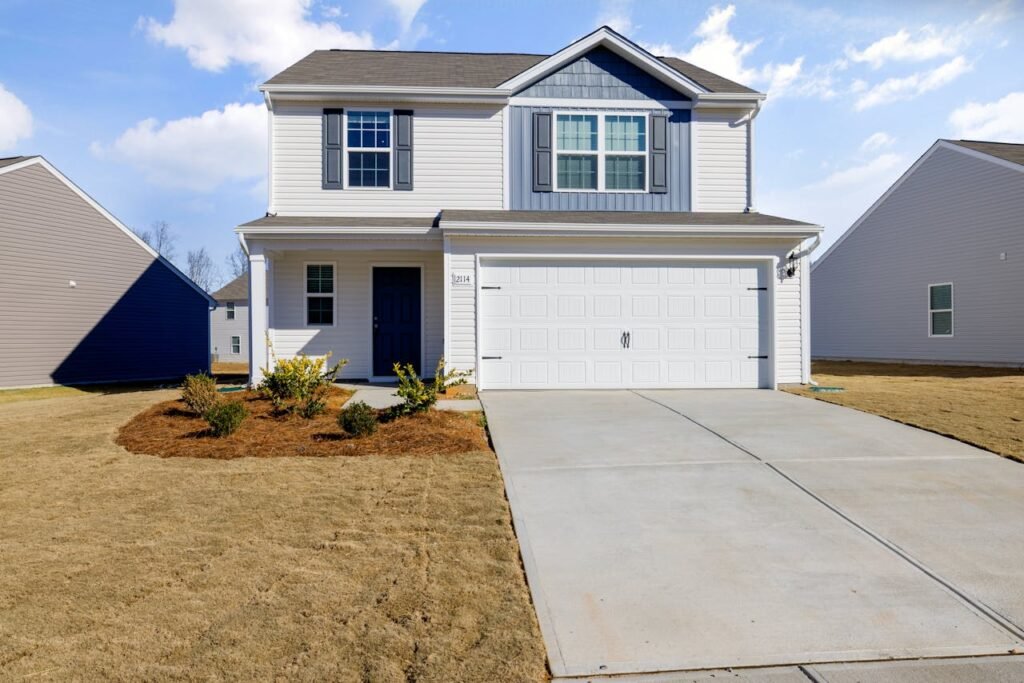 White and Blue House Under Blue Sky fix by Garage Door Repair Winchester, MA
